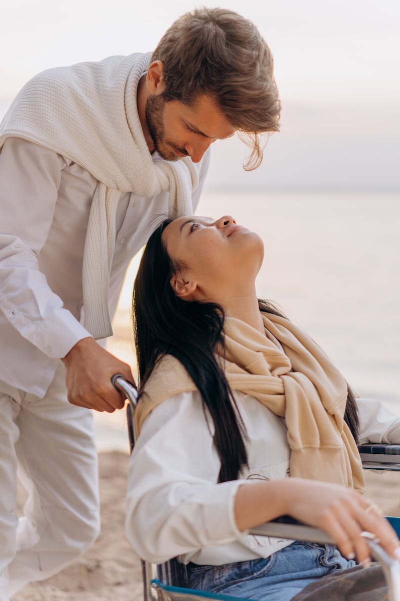 A romantic moment by the seaside with a couple, emphasizing love and support.